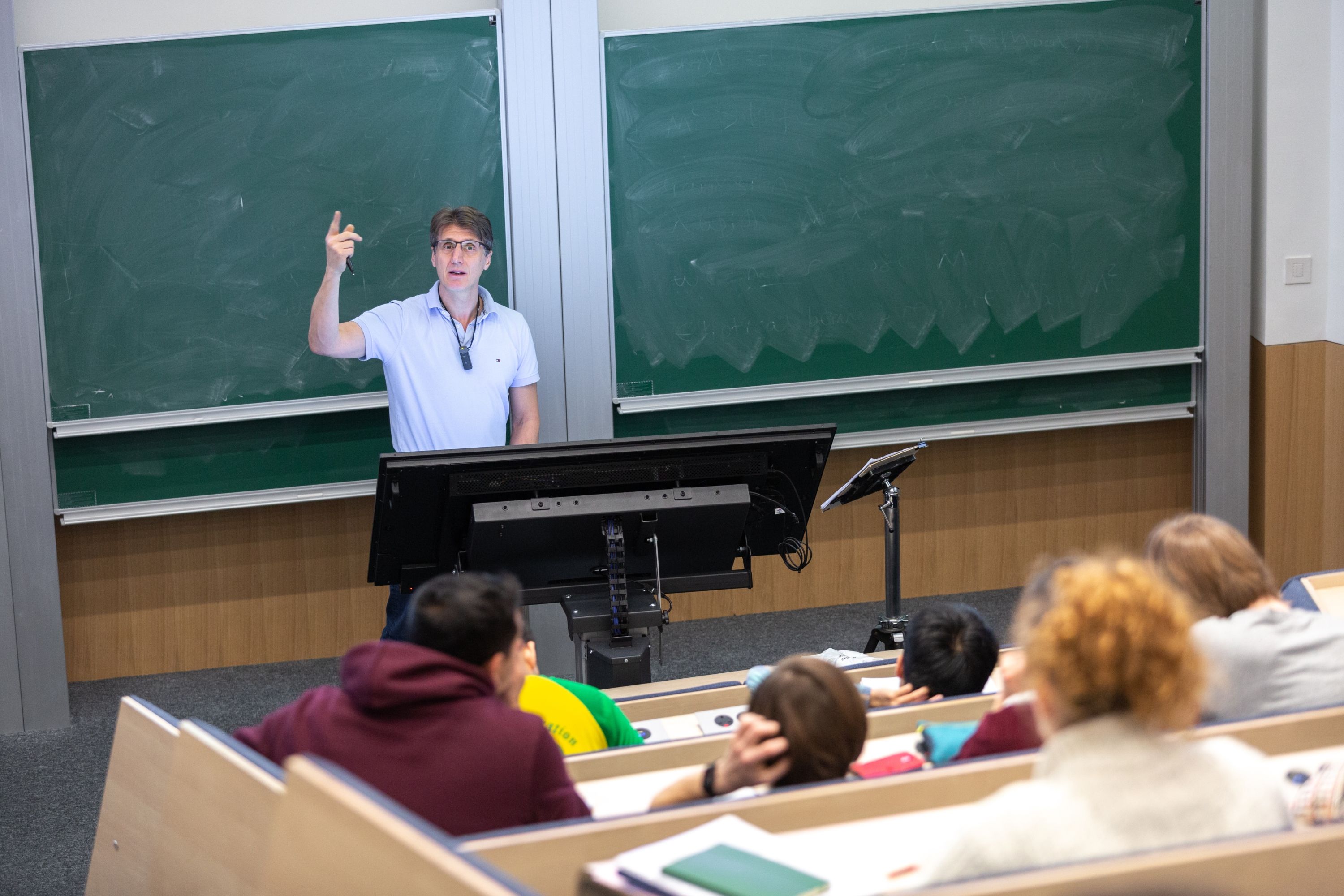 A lecturer speaking to a class
